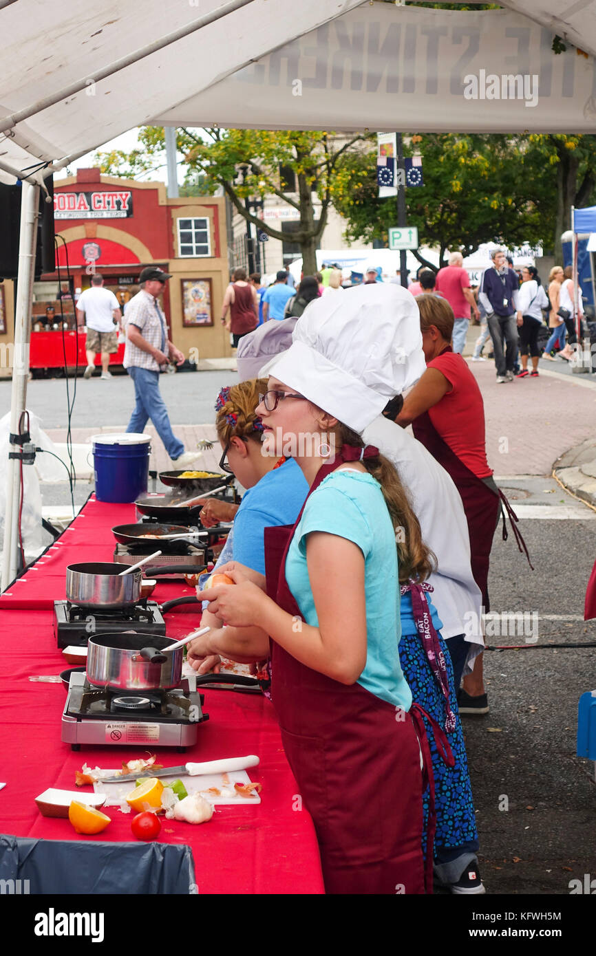 Children cooking outdoors at Garlic fest 2017, Easton, Pennsylvania, United states. Stock Photo