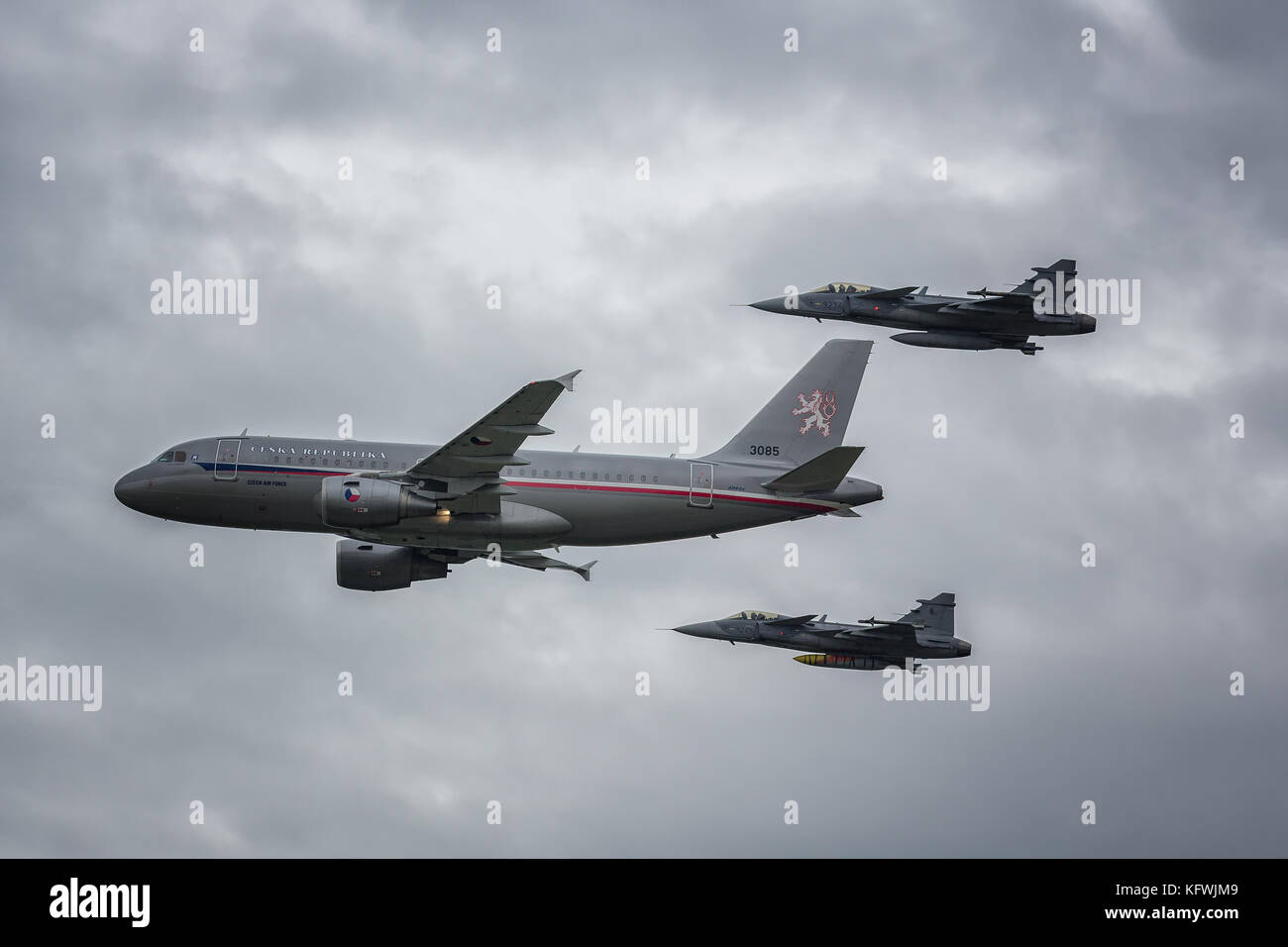 Czech Goverment aircraft escorted by two JAS 39 Gripens from the czech air force Stock Photo