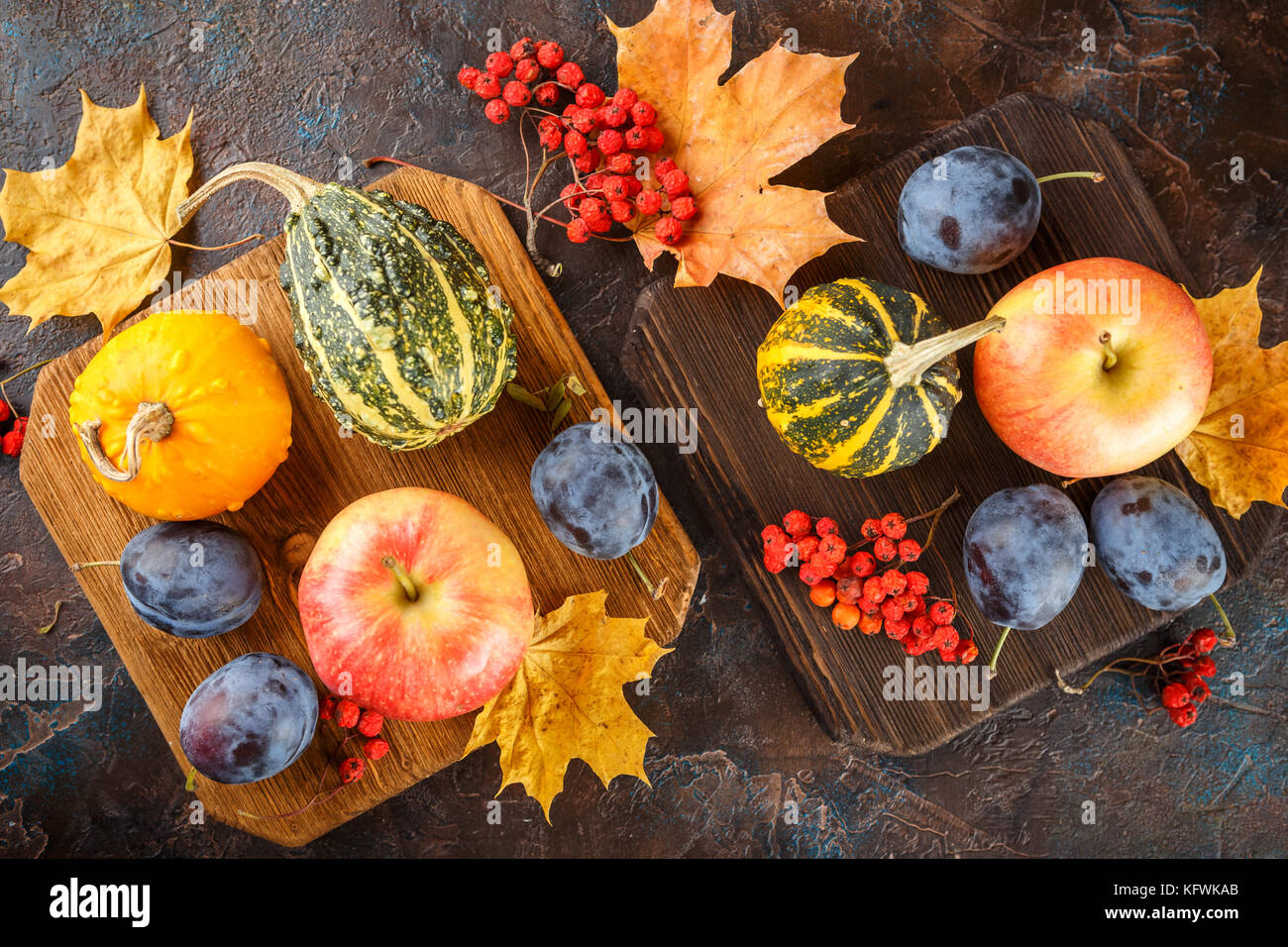 Autumn still life with vegetables and fruits - pumpkins, apples, plums ...