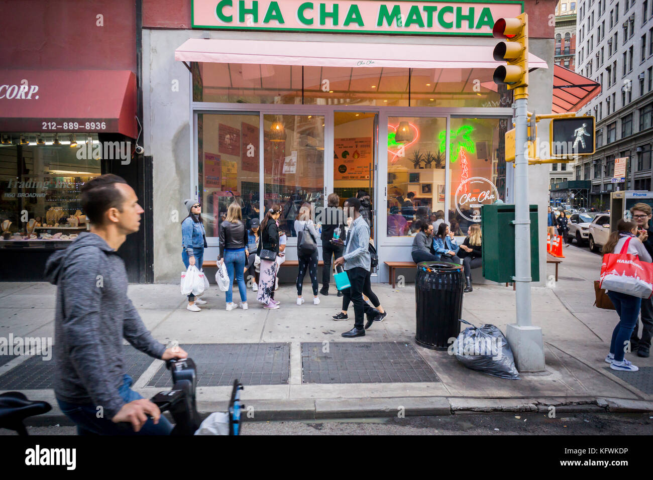 People line up for their fix of matcha at Cha Cha Matcha in the NoMad neighborhood of New York on Saturday, October 28, 2017. The popular beverage, matcha, is ground green tea and is used in Cha Cha Matcha to make instagramable beverages popular with millennials. Loaded with antioxidants matcha supposedly has medicinal qualities. (© Richard B. Levine) Stock Photo