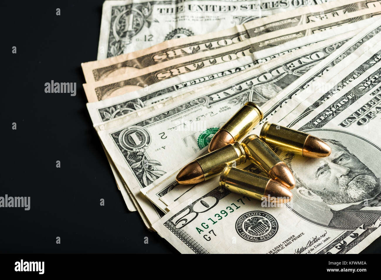 9mm gun bullets and american dollars. Stock Photo