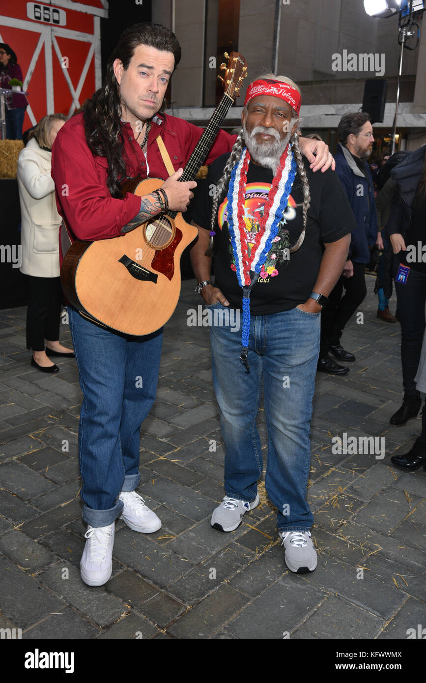 Carson Daly as Billy Ray Cyrus and Al Roker as Willie Nelson perform during Today's Halloween Extravaganza 2017 at Rockefeller Plaza on October 31, 2017 in New York City. credit: Erik Pendzich Stock Photo