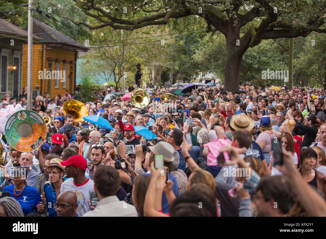 New Orleans, USA. 01st Nov, 2017. Crowds of people filled the street in the lower Ninth Ward for New Orleans style Second Line tribute to Antoine “Fats” Domino who recently passed away. Credit: Tom Pumphret/Alamy Live News Stock Photo