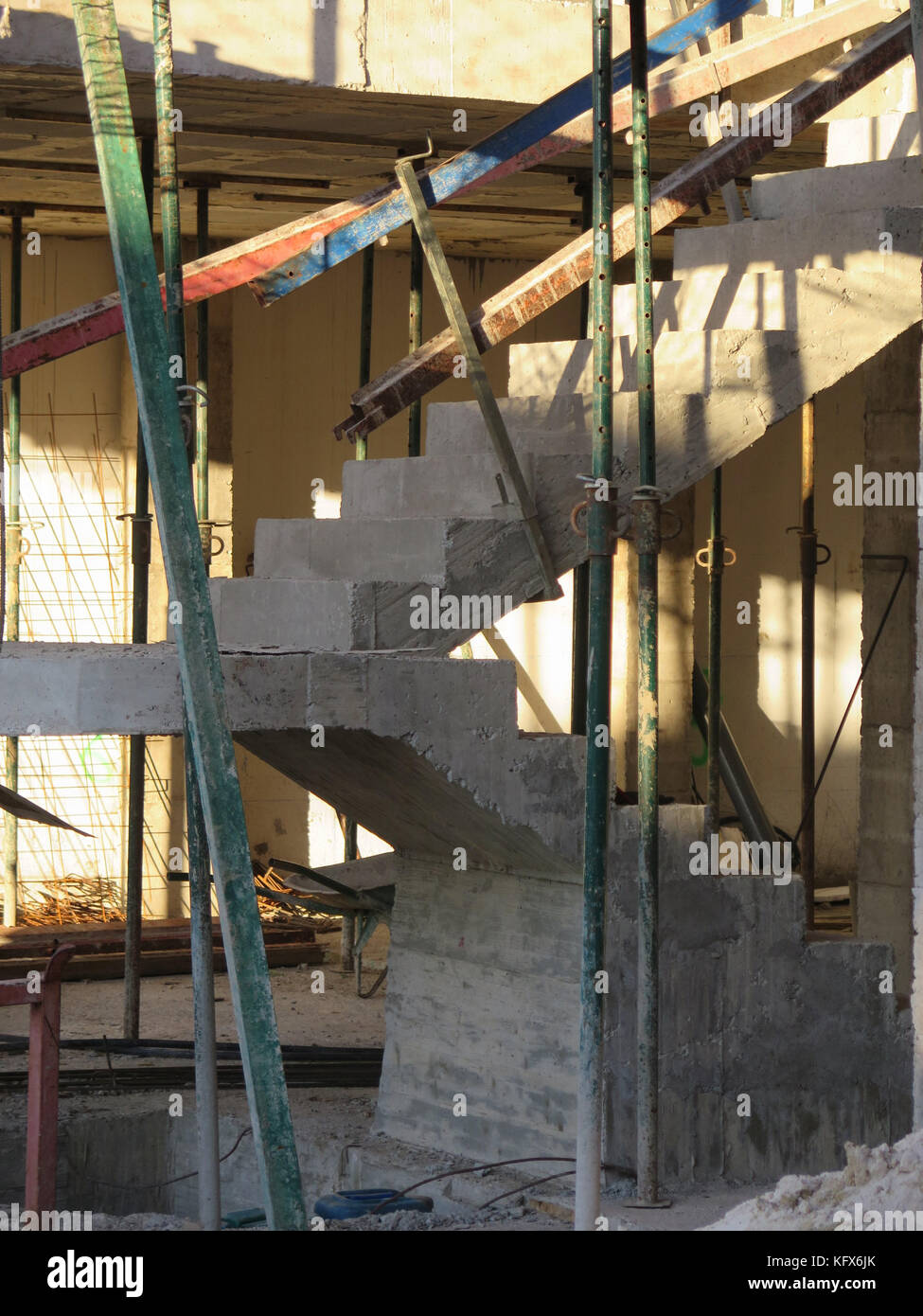 Concrete staircase inside new building being constructed Stock Photo
