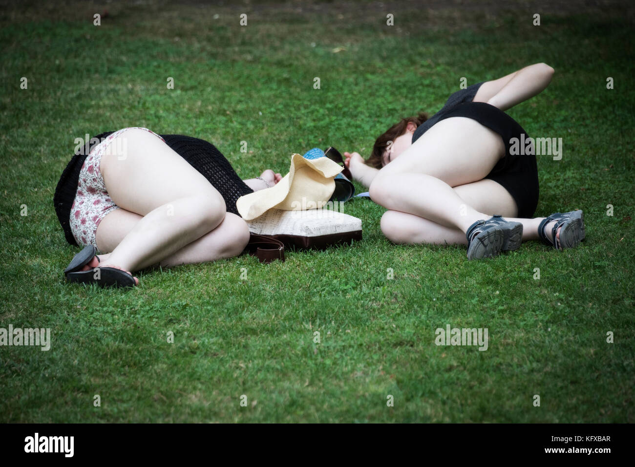 Two females lying on the grass, Venice Stock Photo