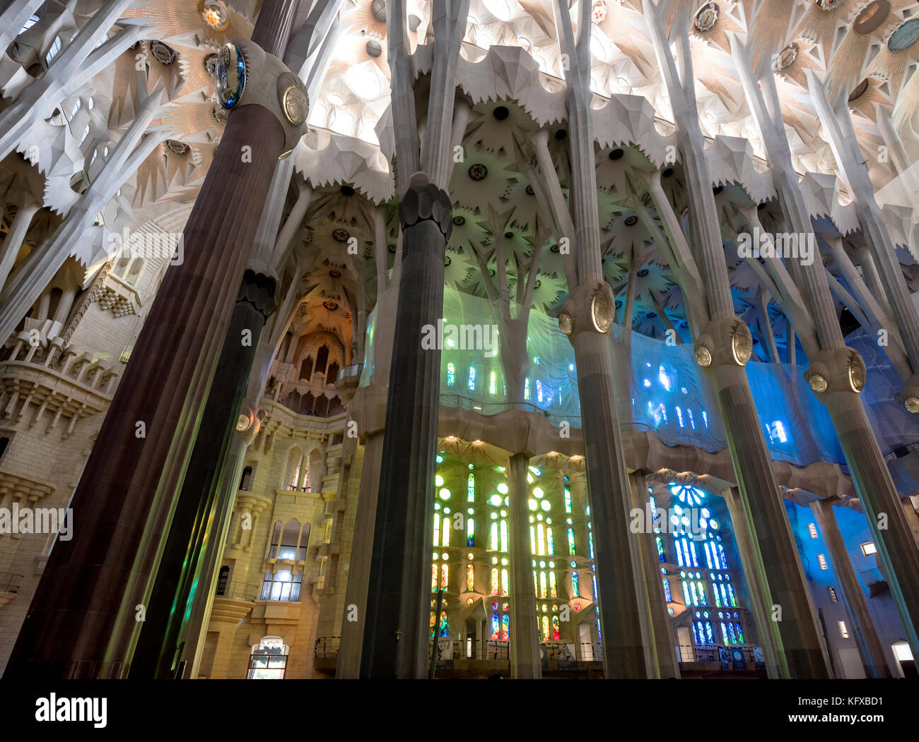 Interior architectural columns and the stained glass windows of the Sagrada Familia in Barcelona Stock Photo