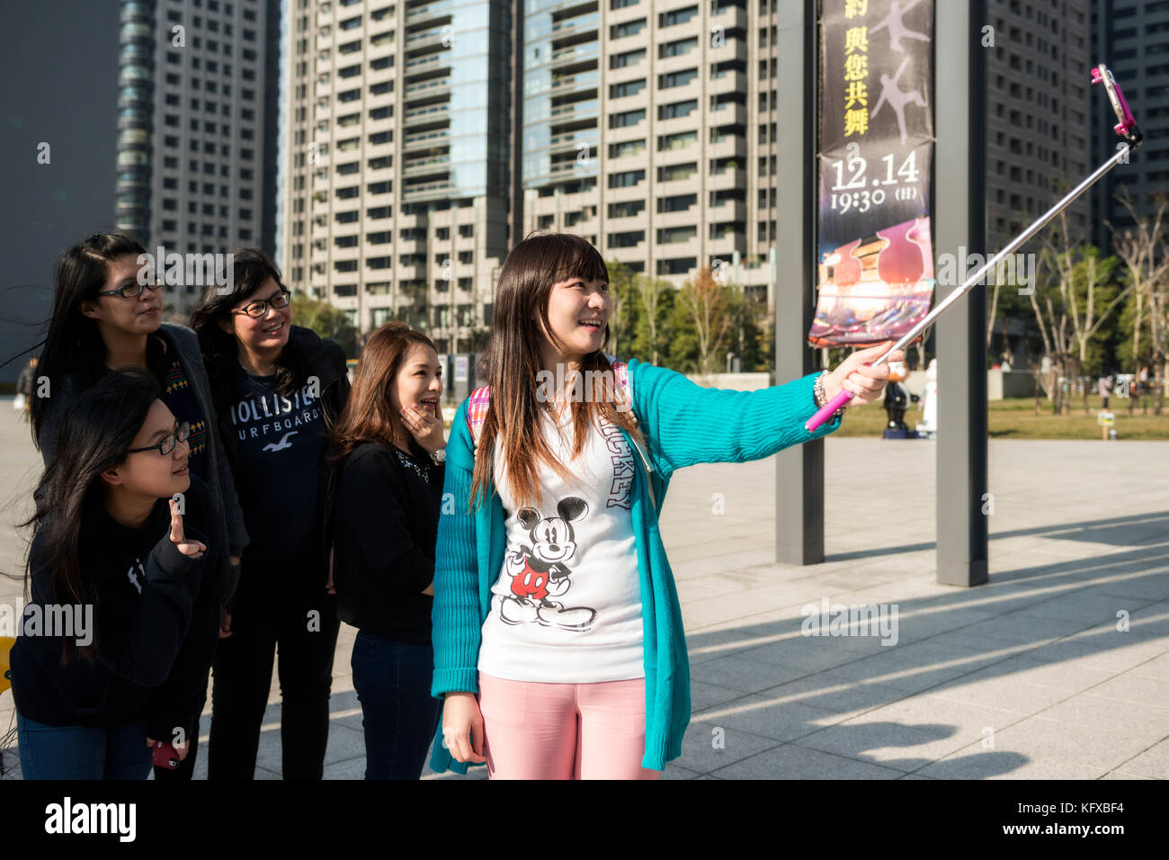 Friends taking a selfie in the city, Taiwan Stock Photo