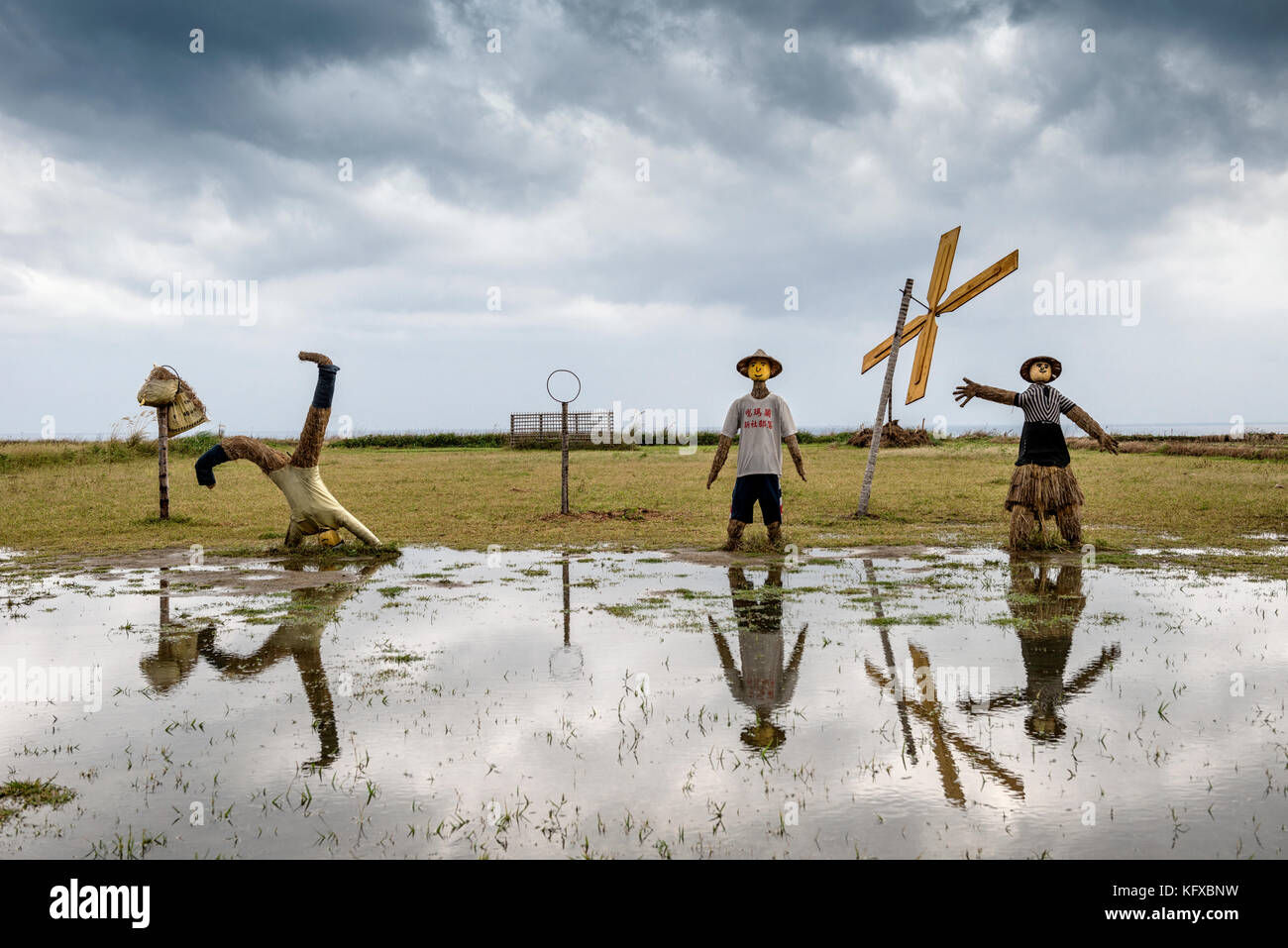 Comical scarecrows in a rice field in Taiwan Stock Photo