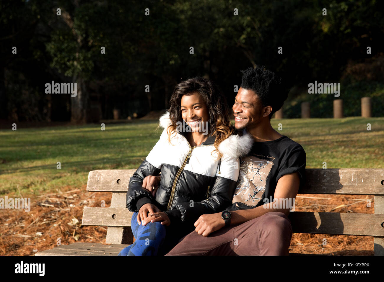 Couple on a park bench Stock Photo