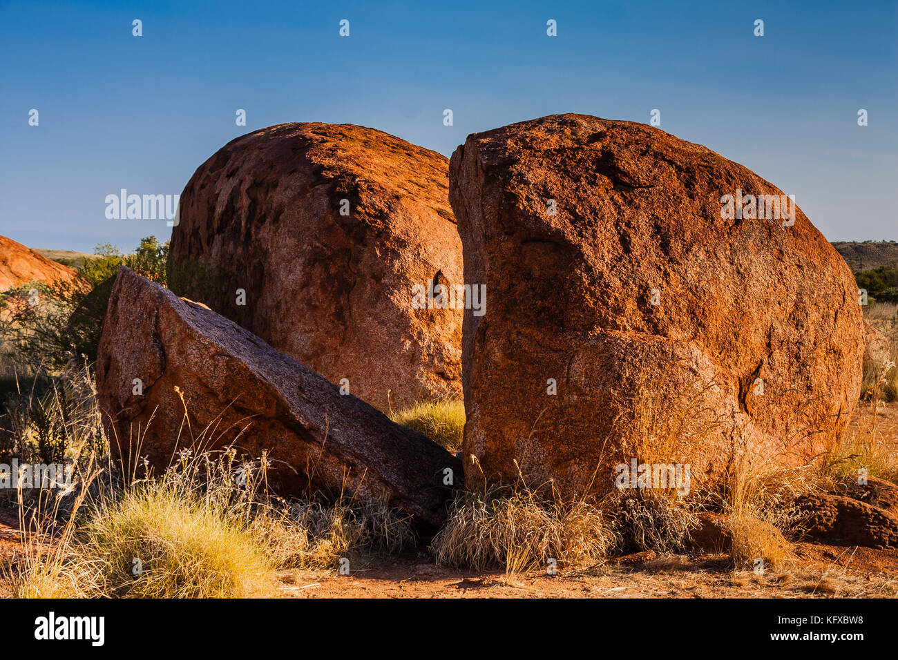 A naturally split boulder in the Devils Marbles (Karlu Karlu) Conservation Reserve, Northern Territory, Australia Stock Photo