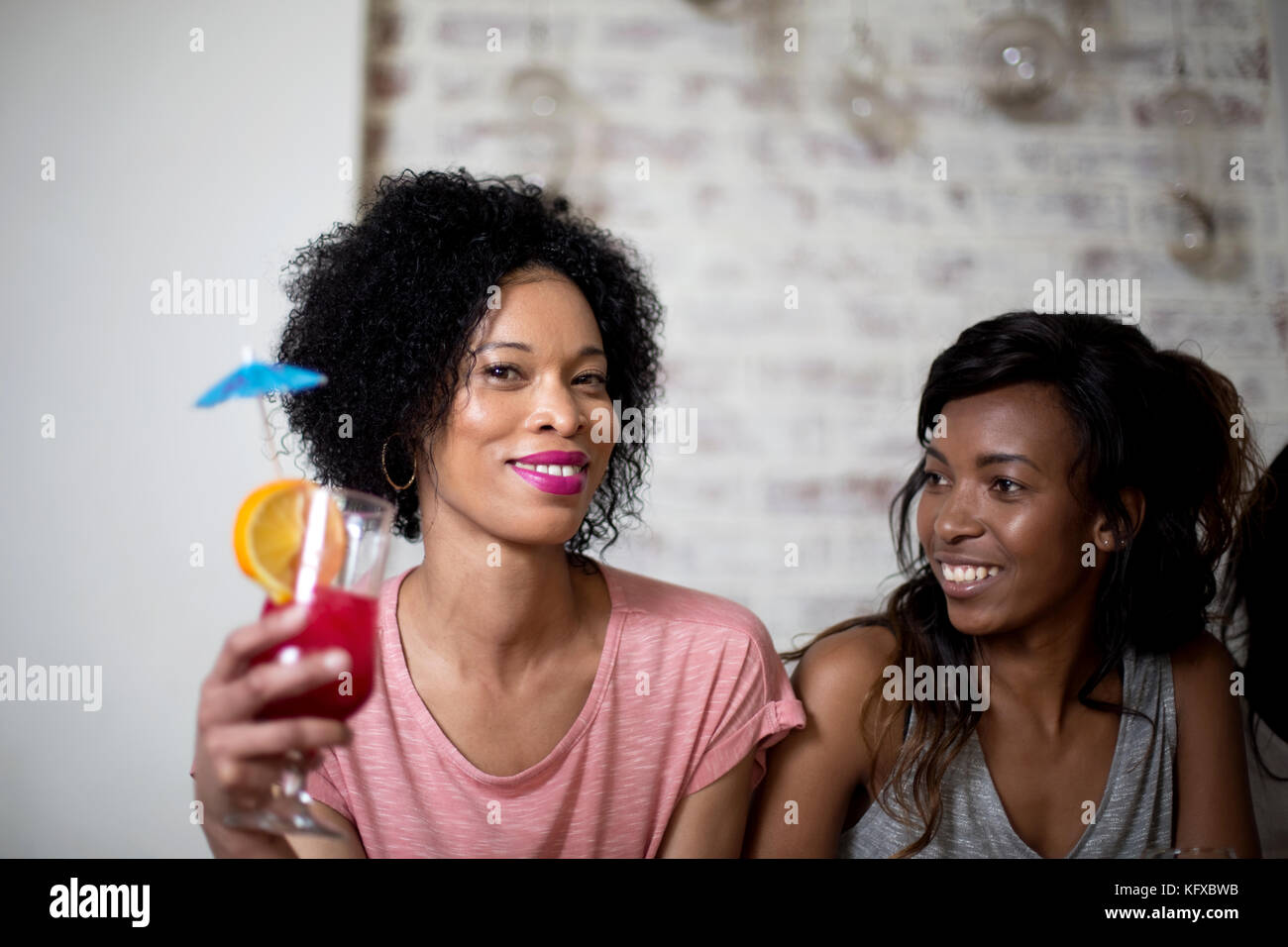 Women drinking cocktails Stock Photo