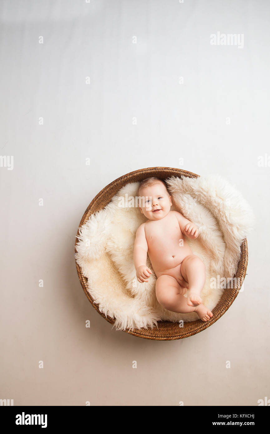 Two generation family studio portrait on grey and white background. Stock Photo