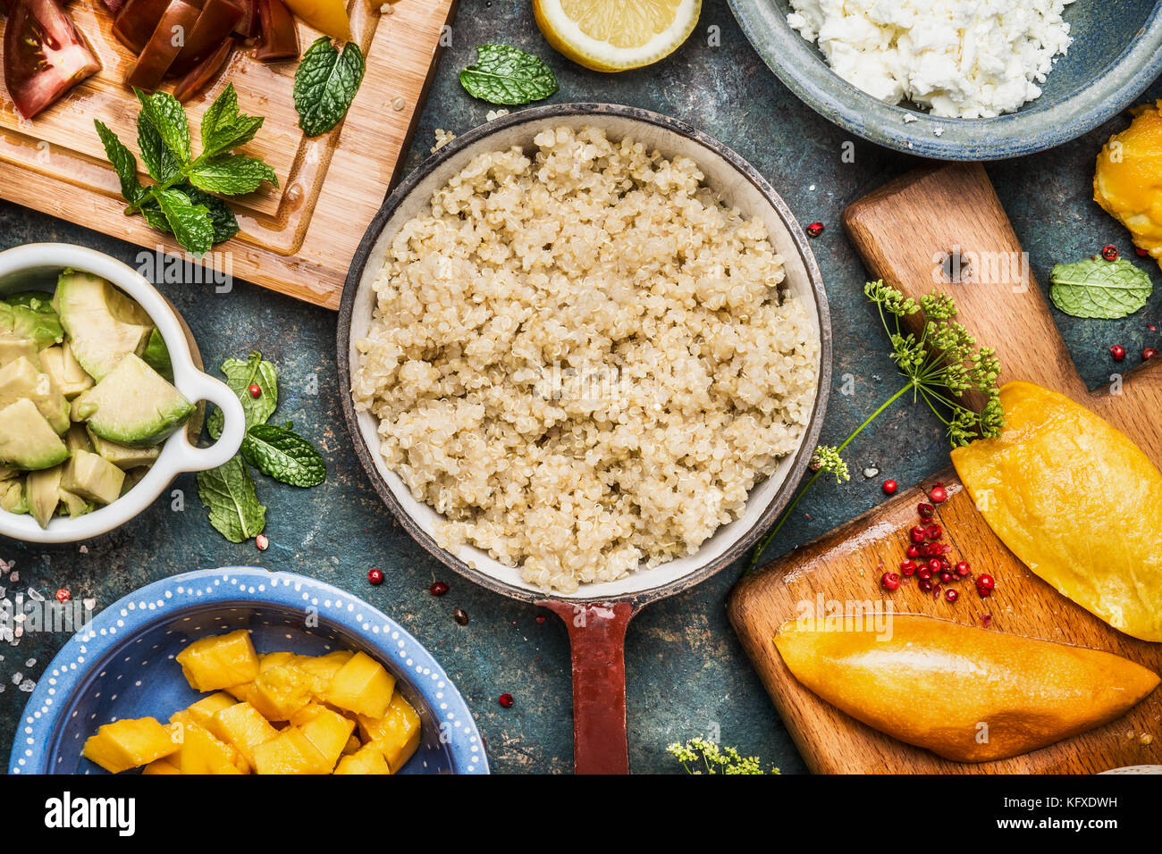 Cooked quinoa in pot with Healthy cooking ingredients, top view, close up Stock Photo