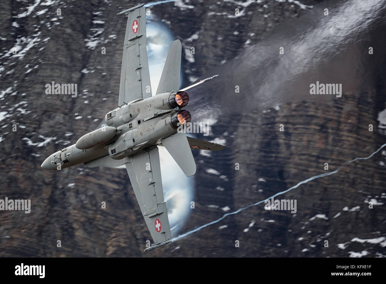 Swiss air force F-18 Hornets pushing hard in the Swiss alps Stock Photo