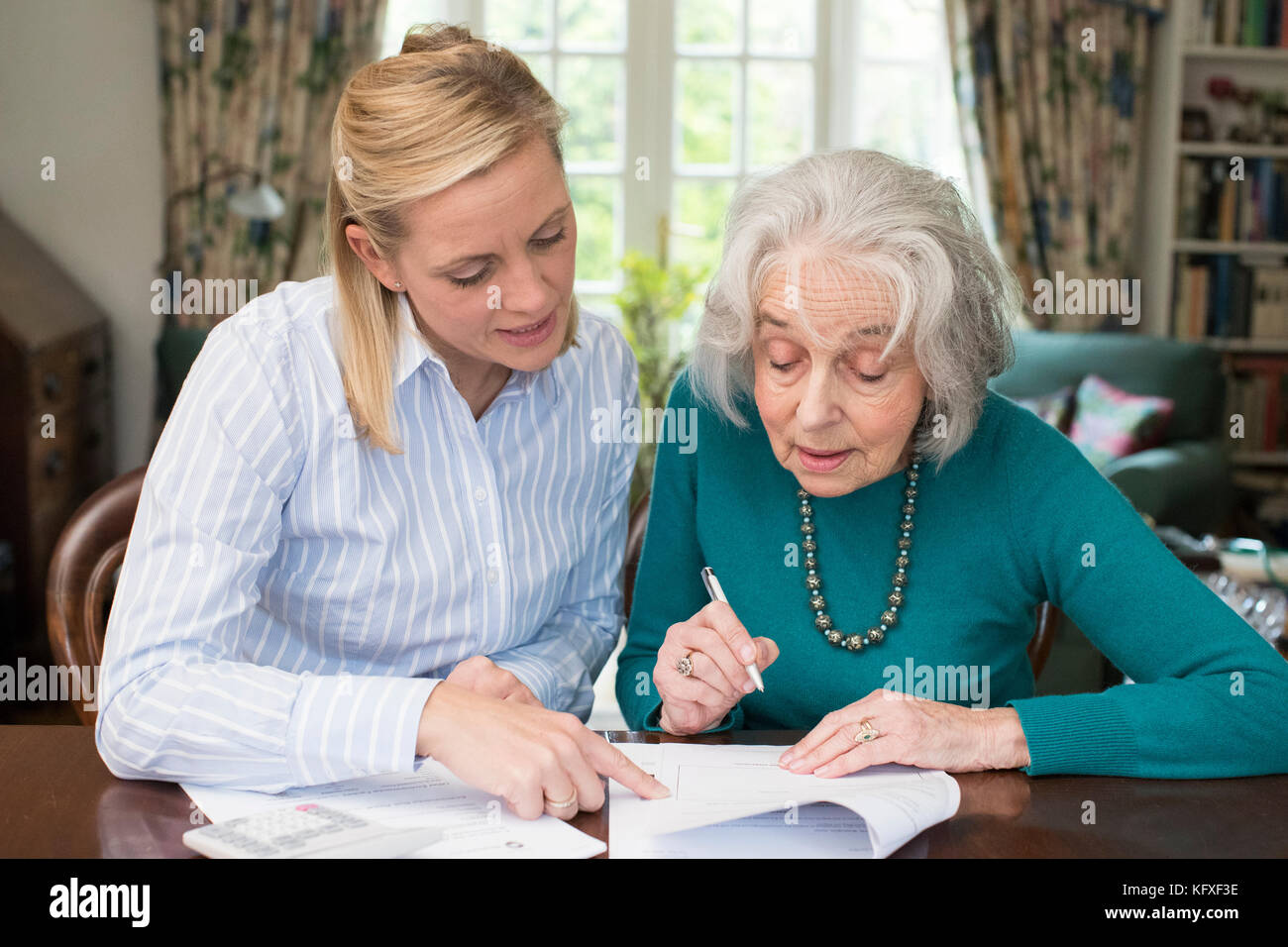 Woman paperwork home mature hi-res stock photography and images - Alamy