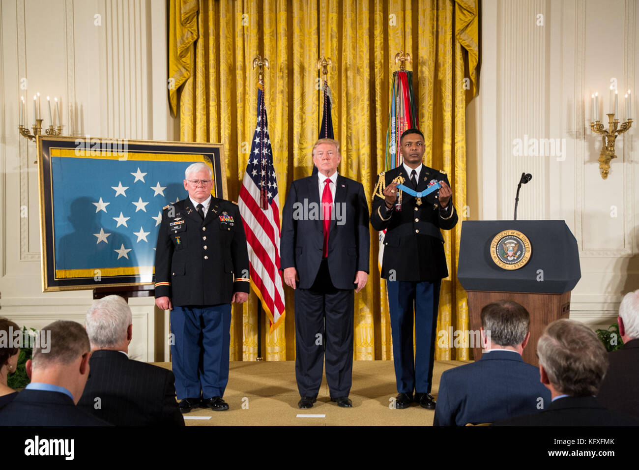 President Donald J. Trump presents the Medal of Honor to Retired Army Capt. Gary M. Rose in the East Room at the White House, Monday, October 23, 2017, in Washington, D.  People:  President Donald J. Trump, Retired Army Capt. Gary M. Rose  Transmission Ref:  MNC  Hoo-Me.com / MediaPunch Stock Photo