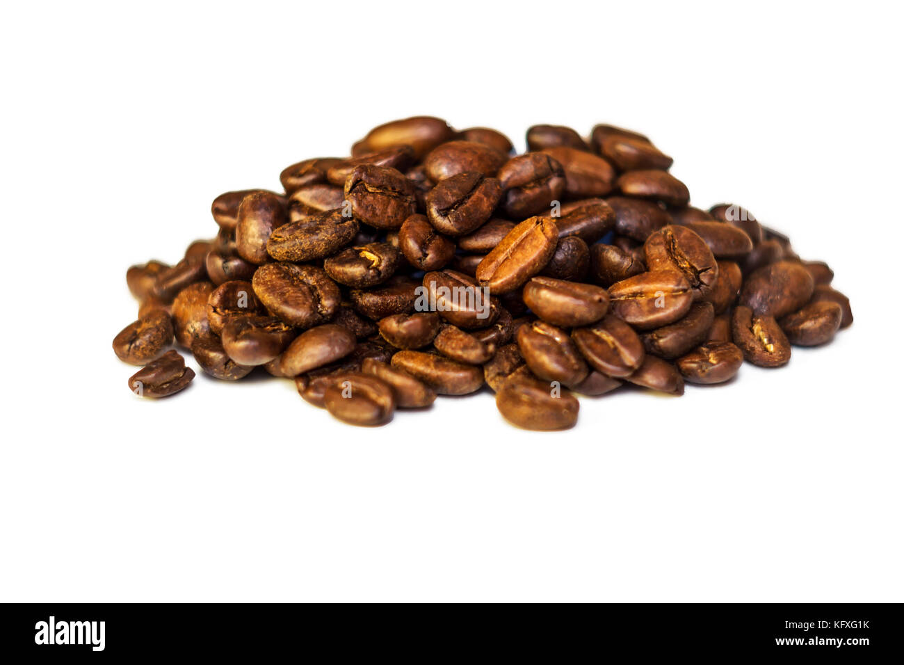 A white background of coffee grains lie slide Stock Photo