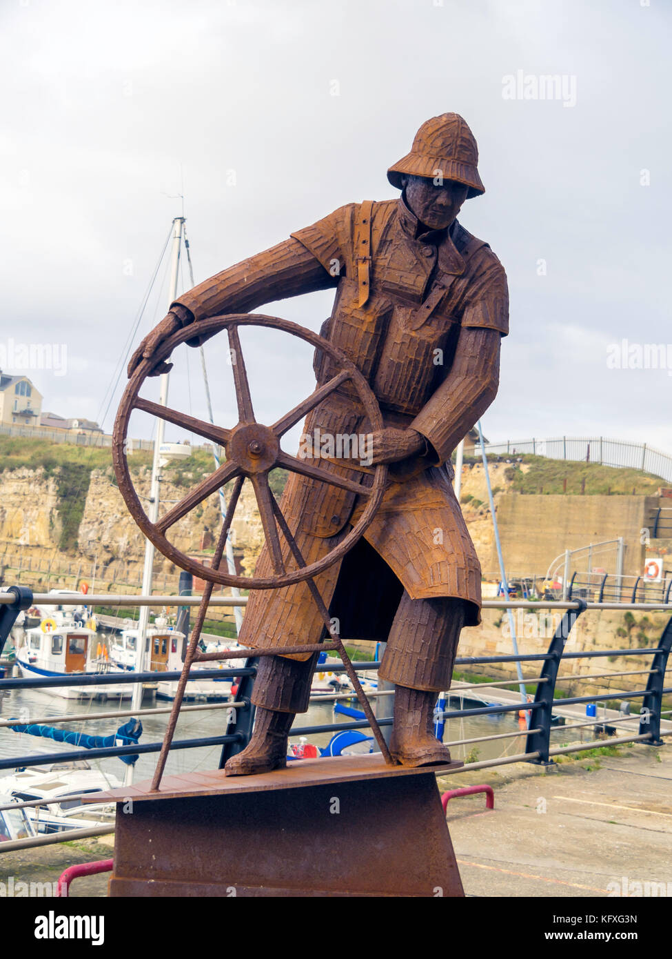The Coxwain a steel sculpture depicting a RNLI Royal National Lifeboat Institution crew man by sculptor Ray Lonsdale at Seaham Harbour County Durham Stock Photo