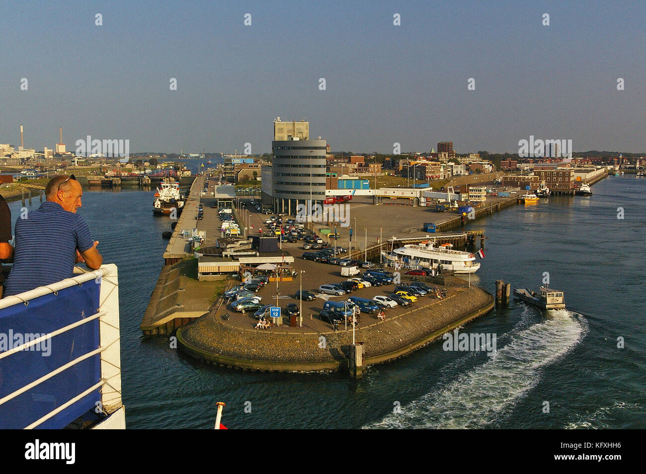IJmuiden, The Netherlands - September 18th, 2014 - Ferry terminal in the port of IJmuiden in the evening sun as seen from the upper deck of a departin Stock Photo