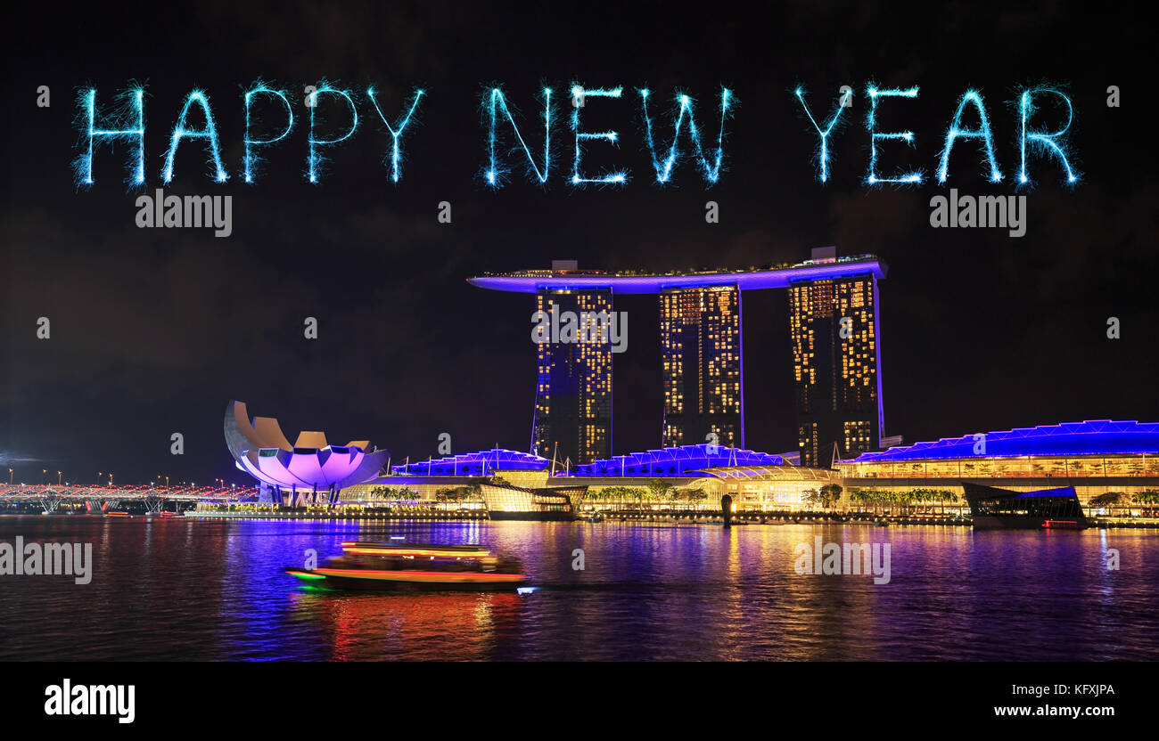 Happy new year firework Sparkle with marina bay at night, urban landscape of Singapore Stock Photo