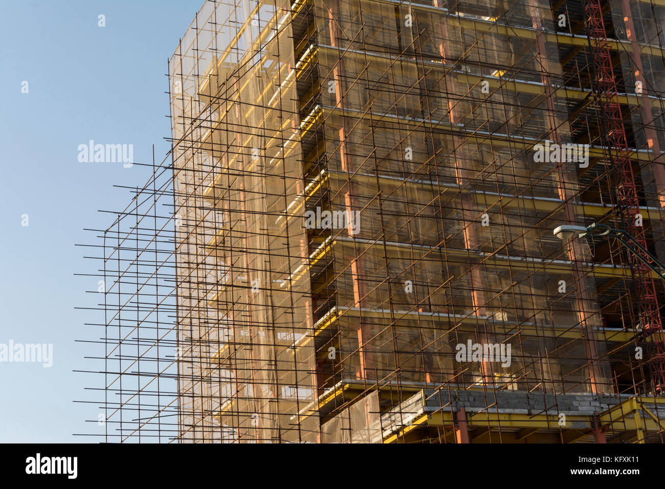 Under Construction Building Covered By Multiple Metal Rods Stock Photo
