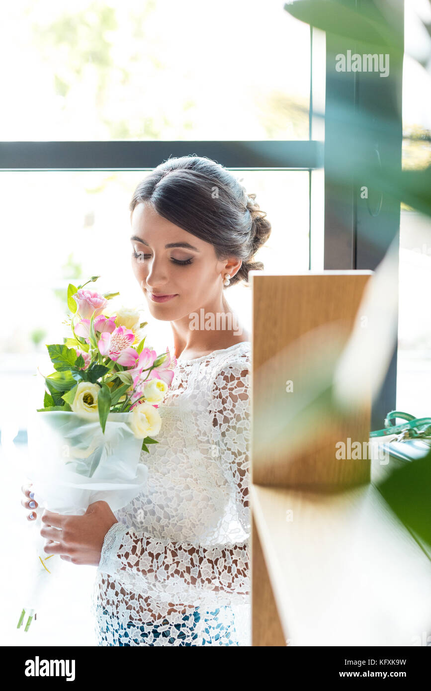 beautiful woman with bouquet of flowers Stock Photo - Alamy