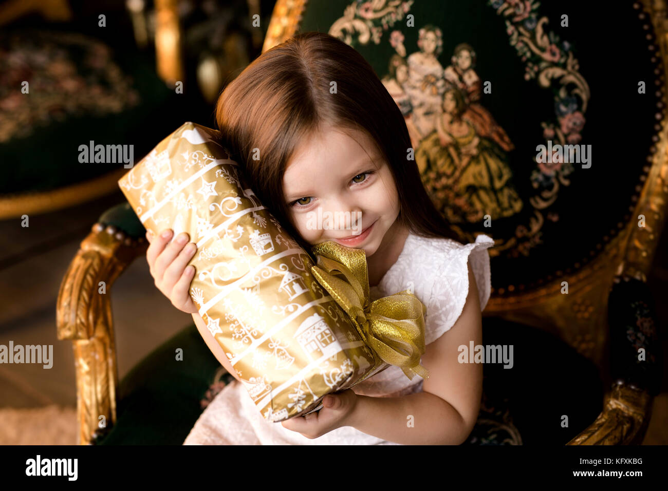 little smiling girl with christmas gift box Stock Photo - Alamy