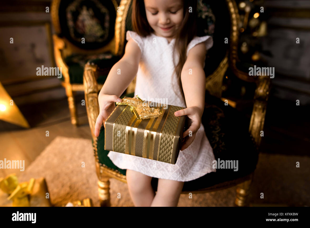 little smiling girl with christmas gift box Stock Photo - Alamy