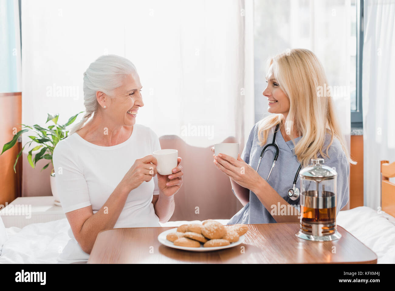 nurse and patient drinking tea Stock Photo Alamy