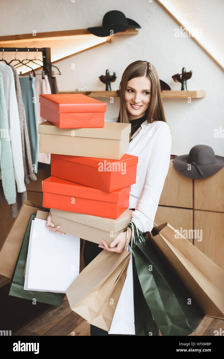 woman with shopping bags and boxes Stock Photo Alamy