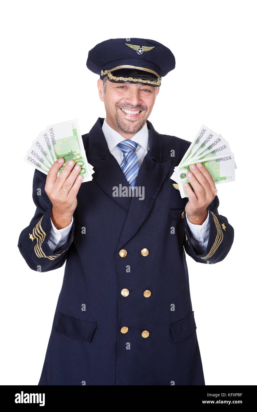 Portrait Of Happy Pilot Holding Euros On White Background Stock Photo