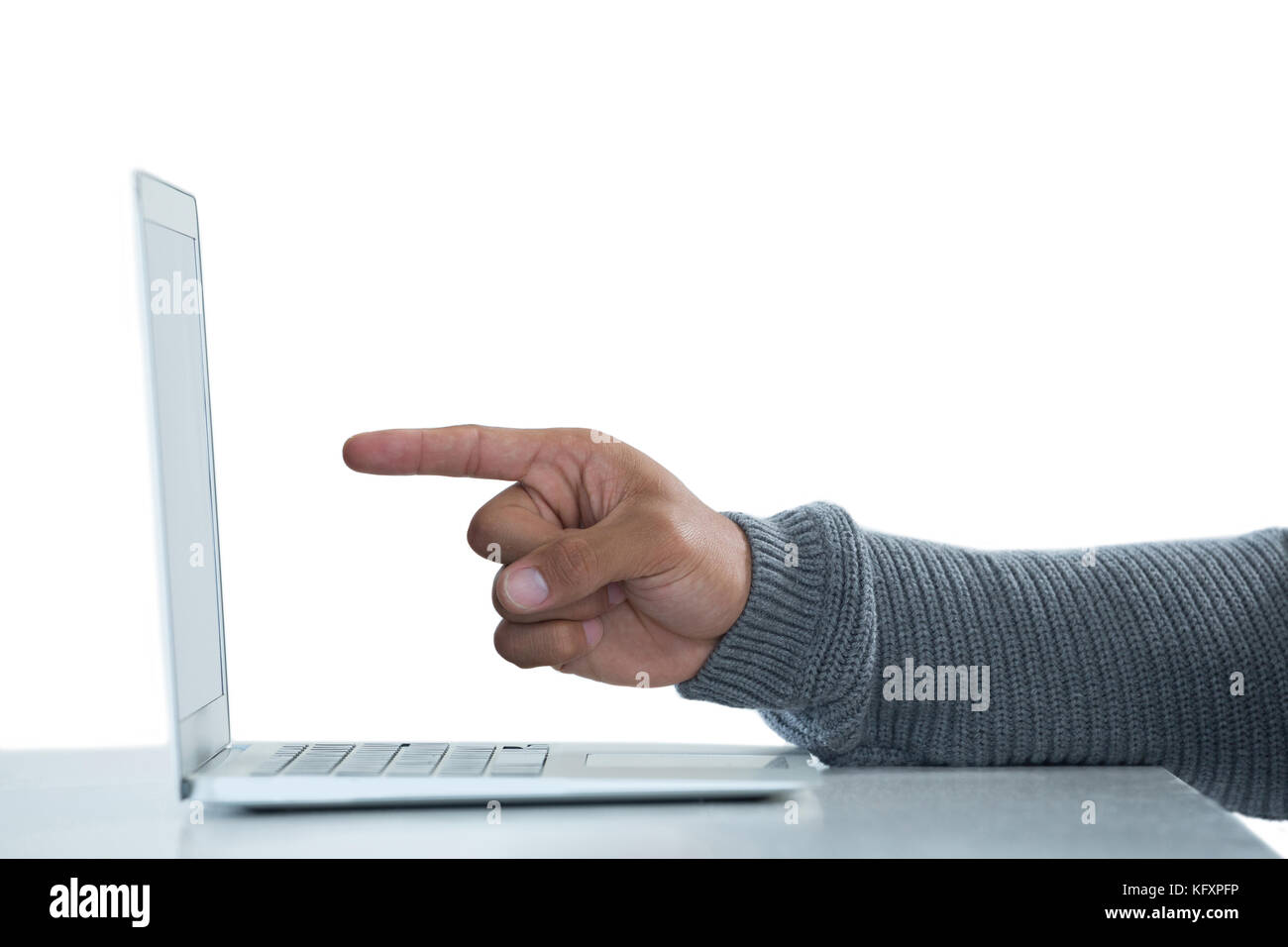 Hand of male executive pointing towards laptop Stock Photo - Alamy