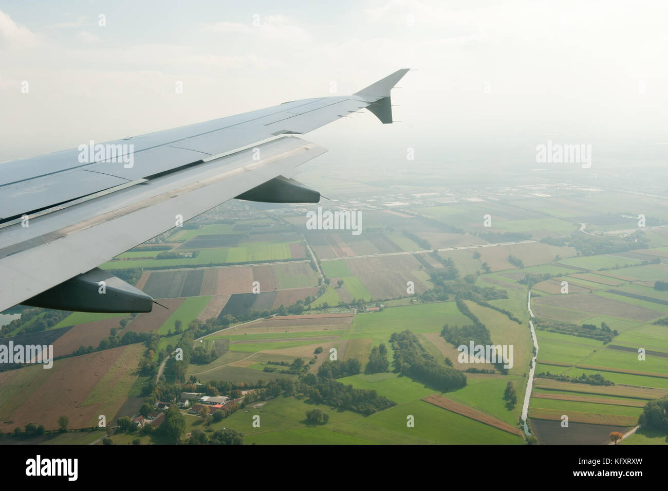 Wing of an in-flight plane Airbus during at flight Stock Photo