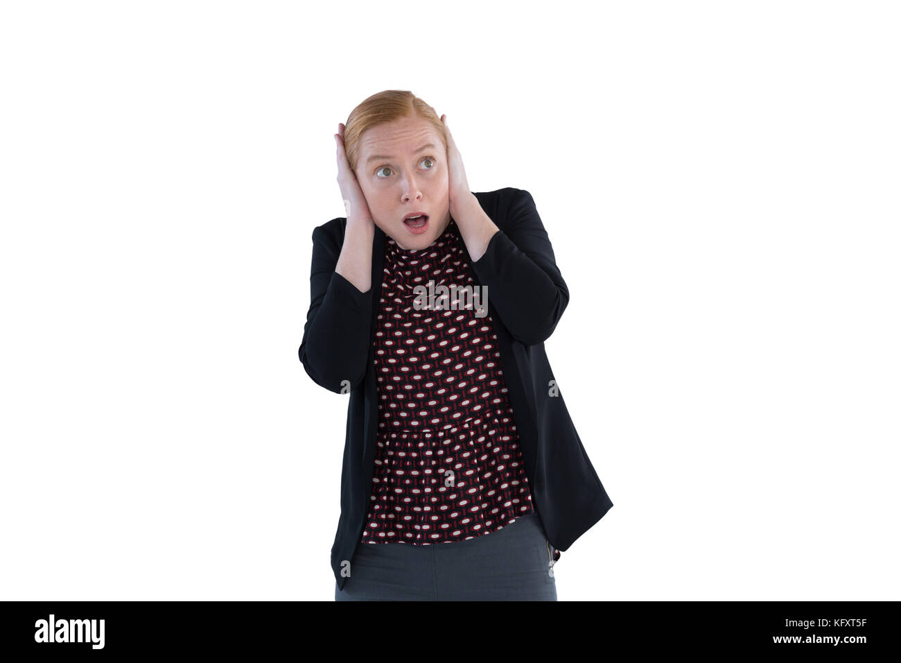 Scared woman covering her ears against white background Stock Photo Alamy