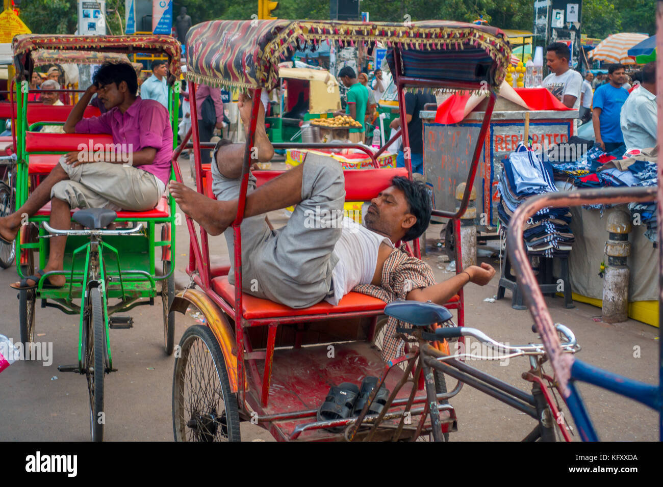 DELHI, INDIA - SEPTEMBER 25 2017: Unidentified man resting over his red ...