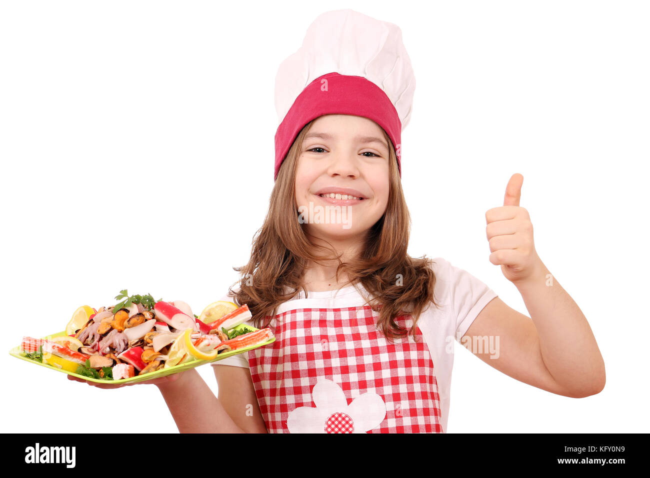 happy little girl cook with seafood and thumb up Stock Photo