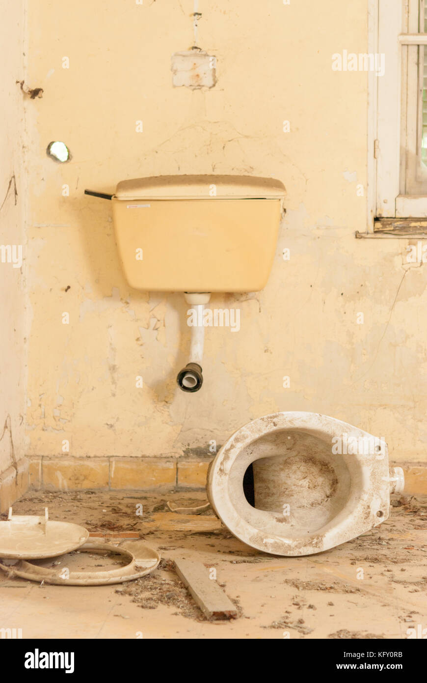 Broken toilet in abandoned sanatorium - hospital room Stock Photo