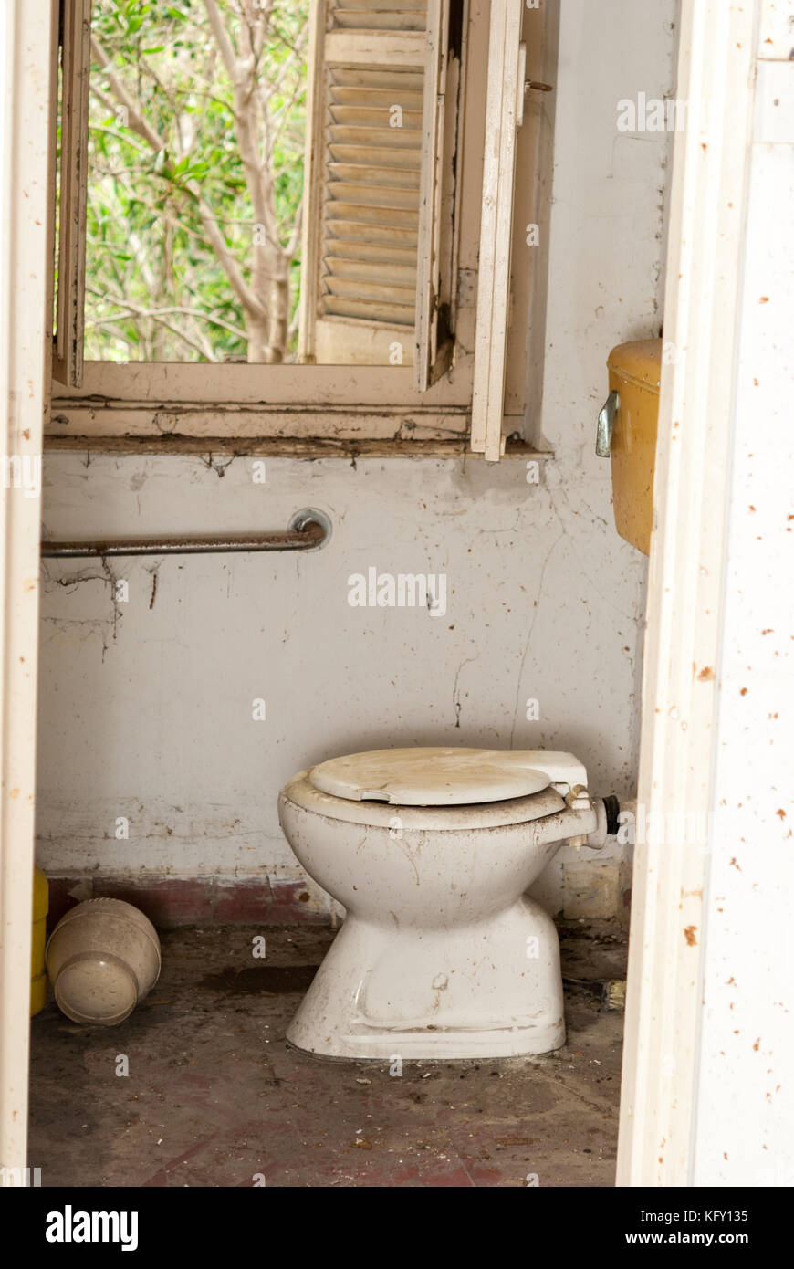 Broken toilet in abandoned sanatorium - hospital room Stock Photo