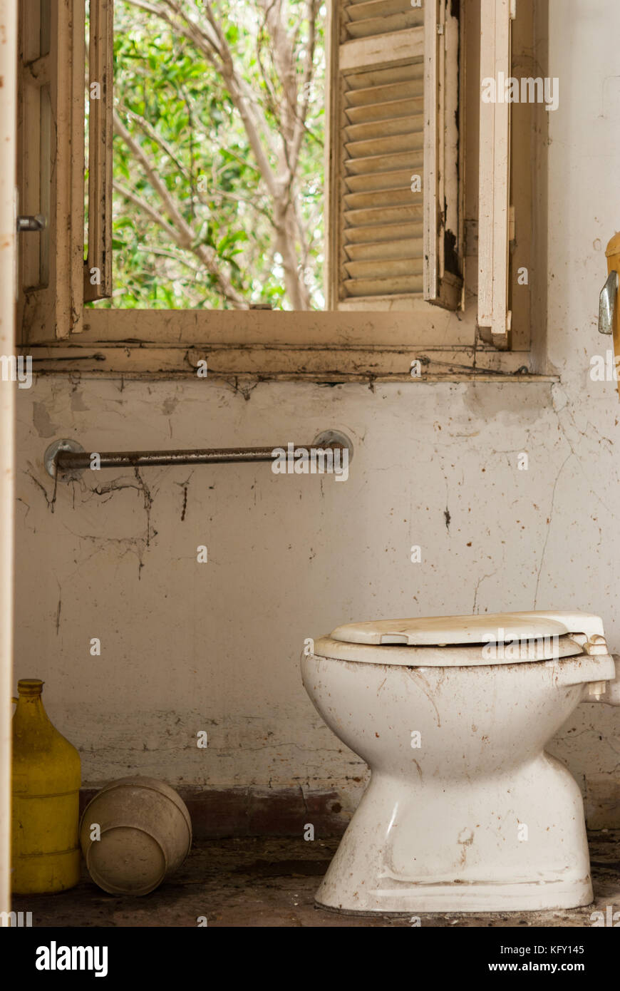 Broken toilet in abandoned sanatorium - hospital room Stock Photo