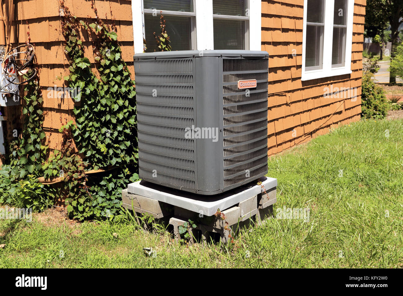 Central air conditioning compressor Long Island New York Stock Photo
