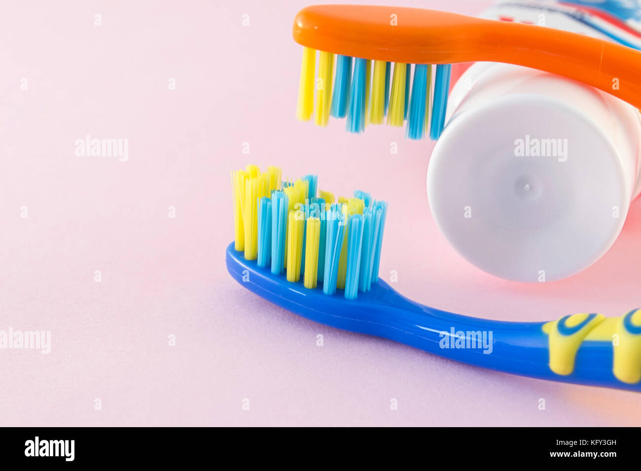 Baby toothbrushes and toothpaste on color background Stock Photo Alamy