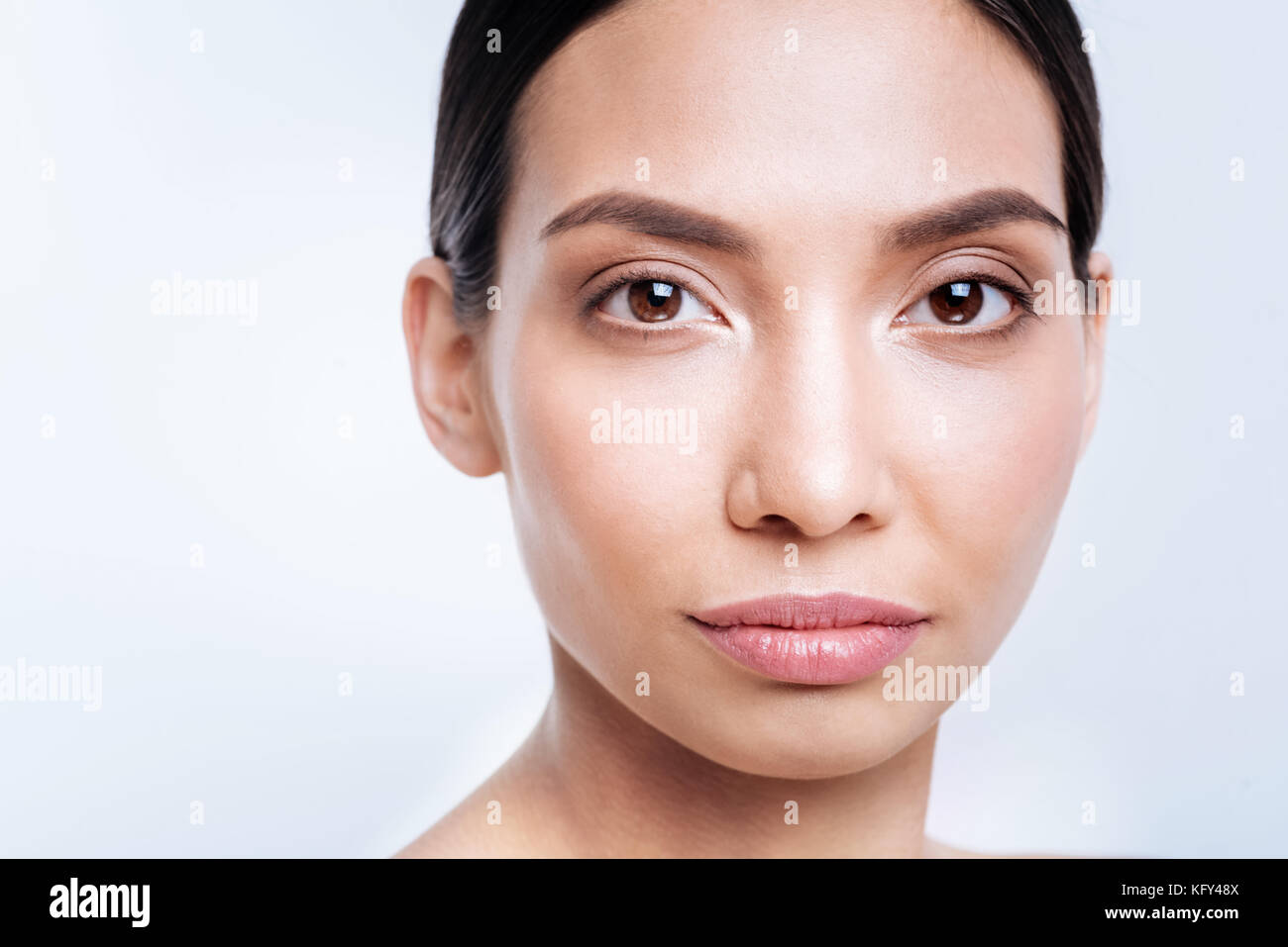 Close up of dark-haired dark-eyed woman with full lips Stock Photo - Alamy