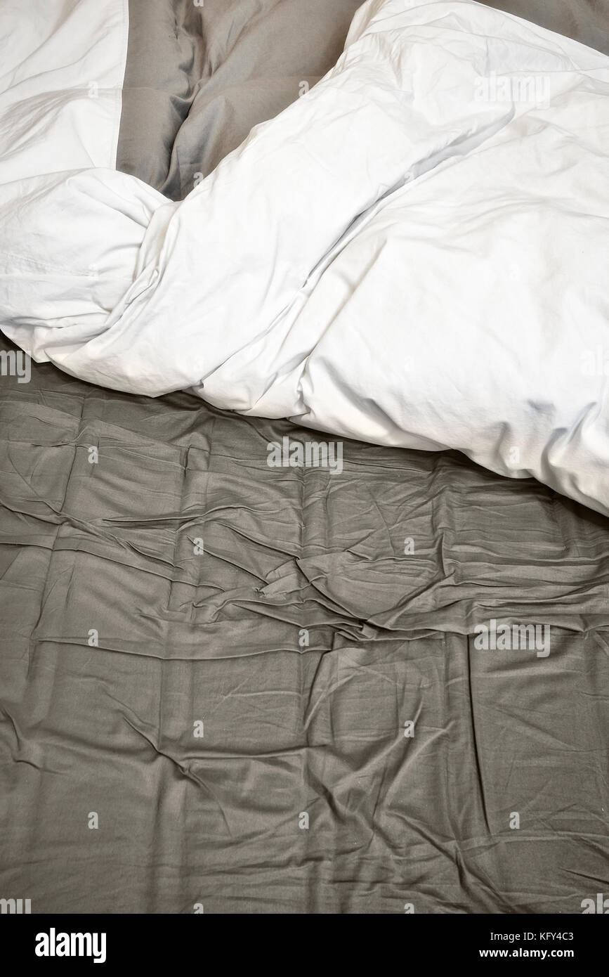 Disheveled sheets and pillows of an unmade bed Stock Photo Alamy