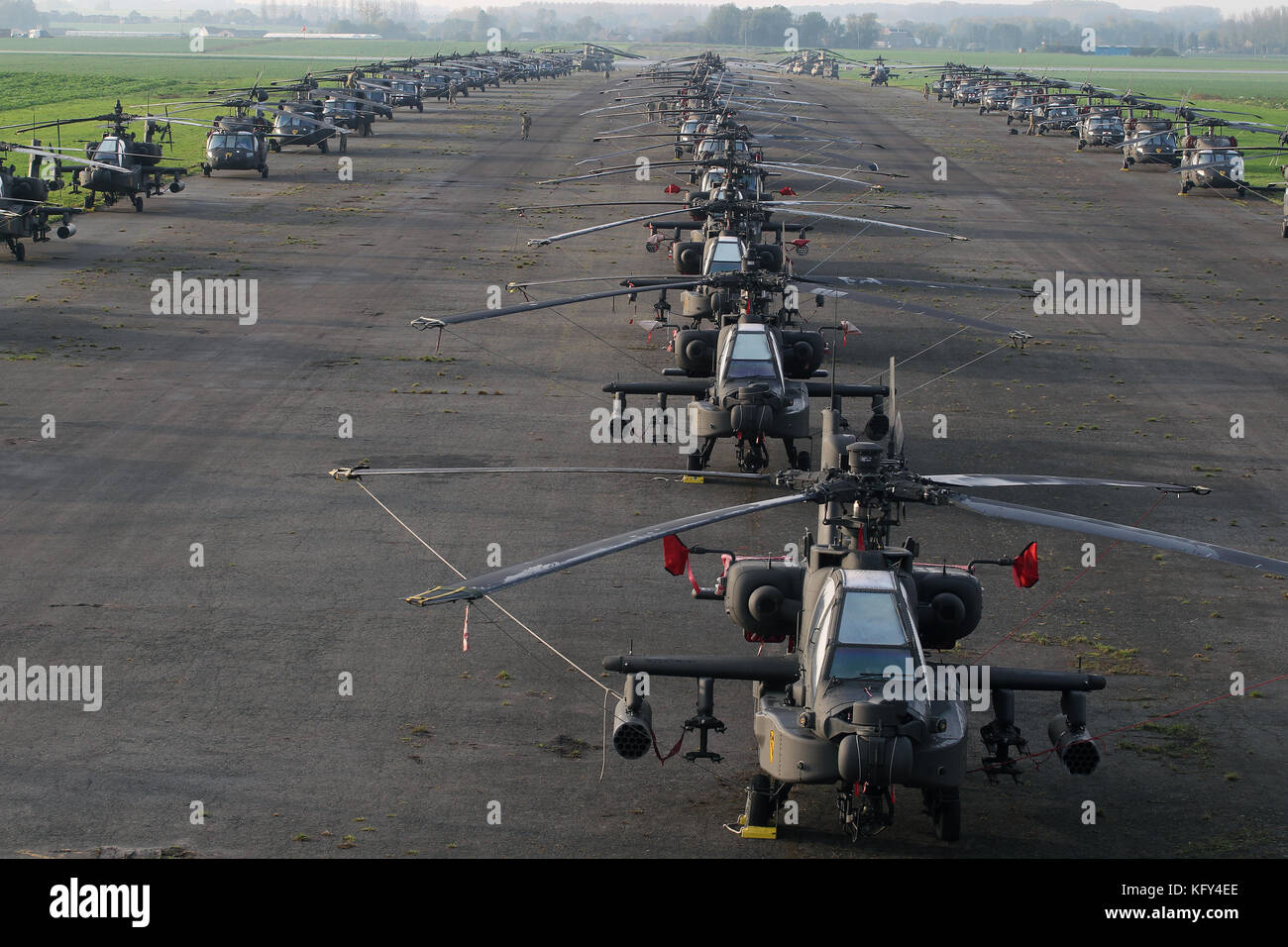 U.S. Army helicopters from the 1st Air Cavalry Brigade of the 1st Cavalry Division Fort Hood, Texas line the runway at Chievres Air Base Belgium Stock Photo