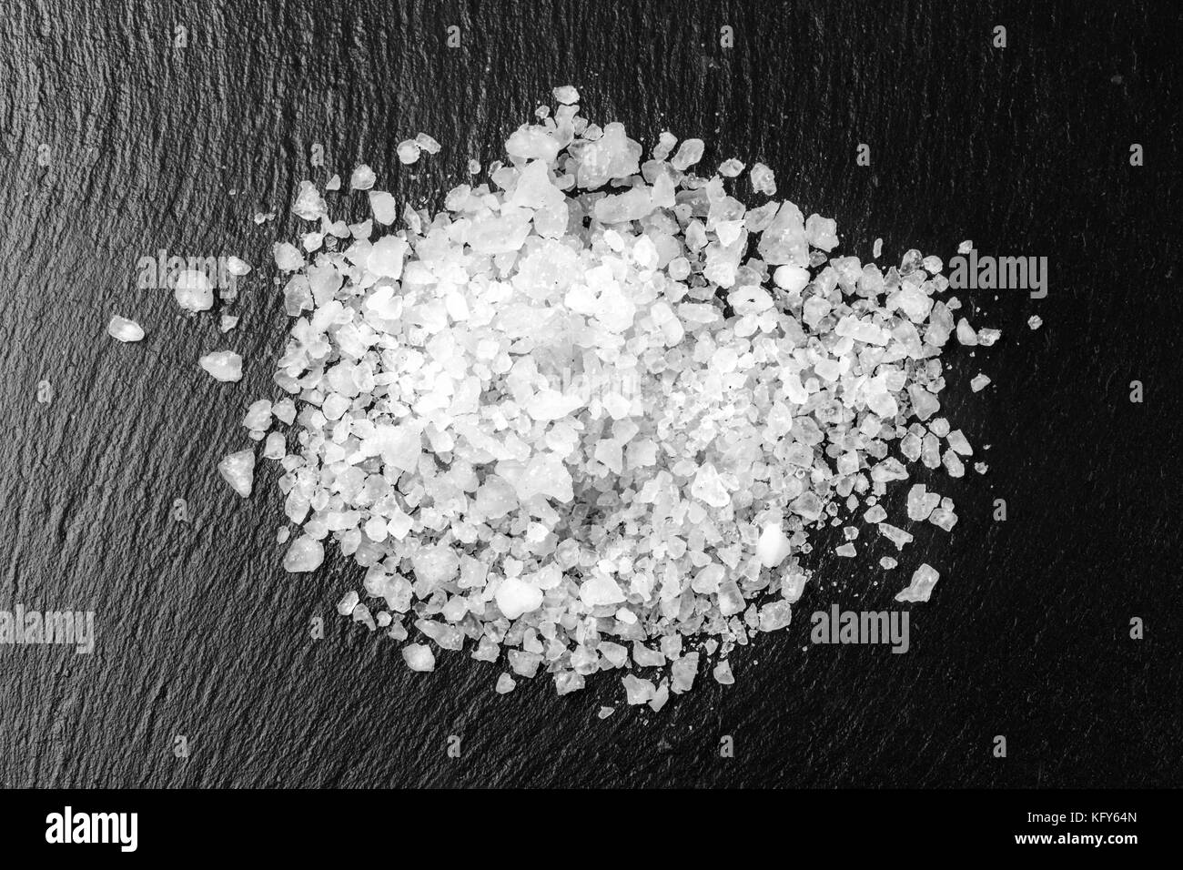 white salt on black background with copy space Stock Photo