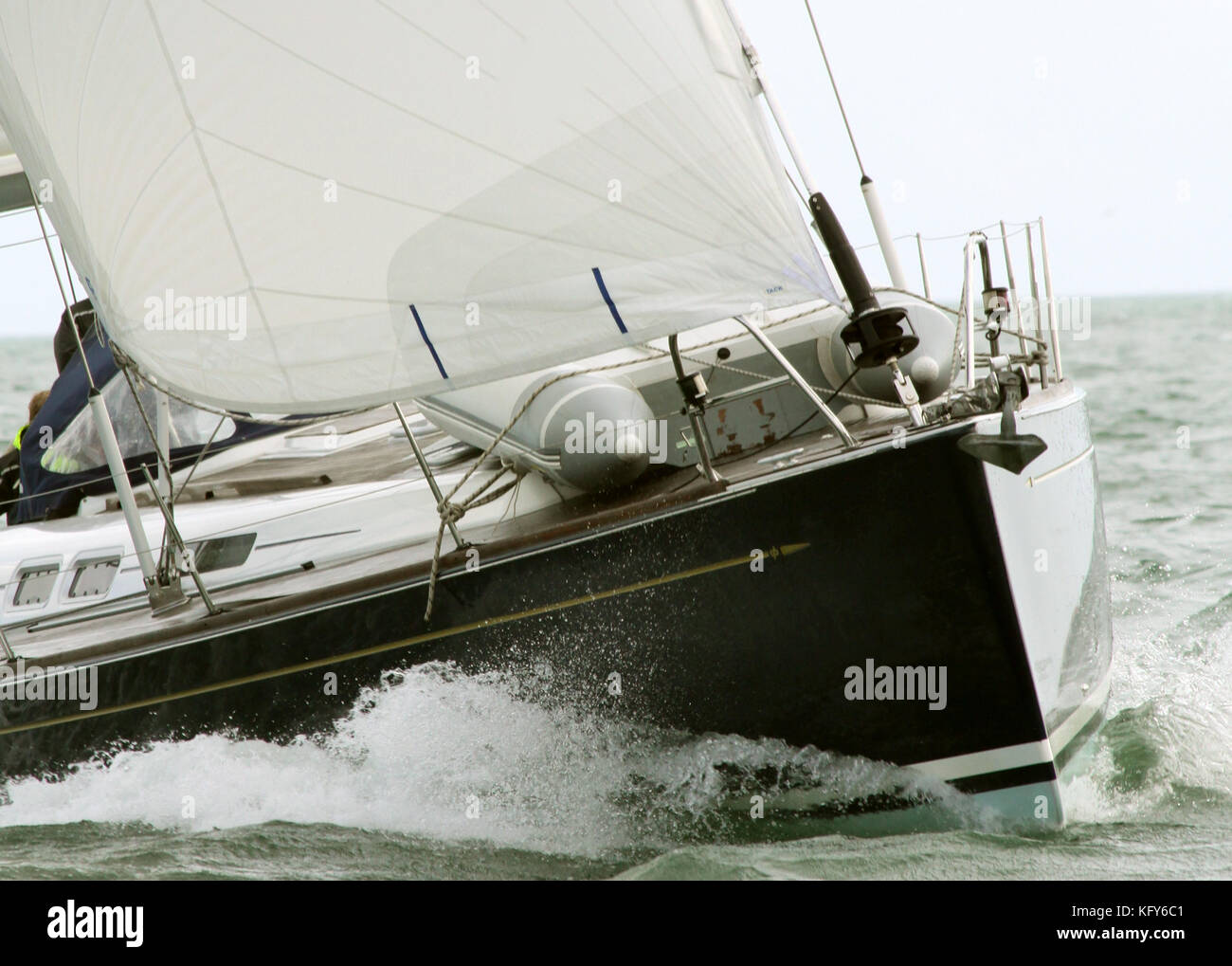dramatic shot of sailing yacht bearing down at close quarters Stock