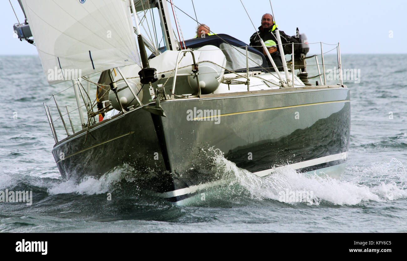 dramatic shot of sailing yacht bearing down at close quarters Stock