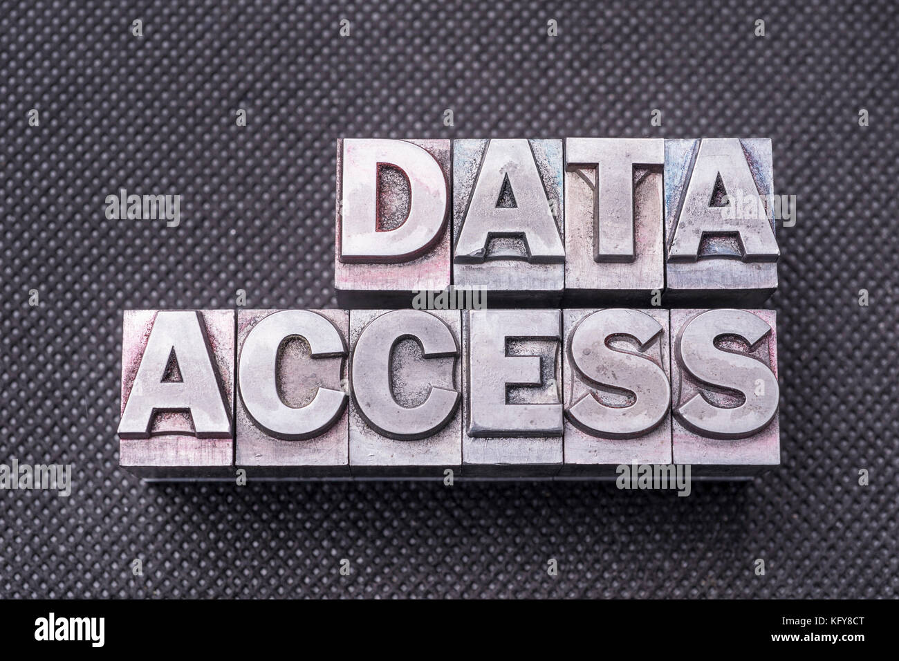 data access phrase made from metallic letterpress blocks on black perforated surface Stock Photo