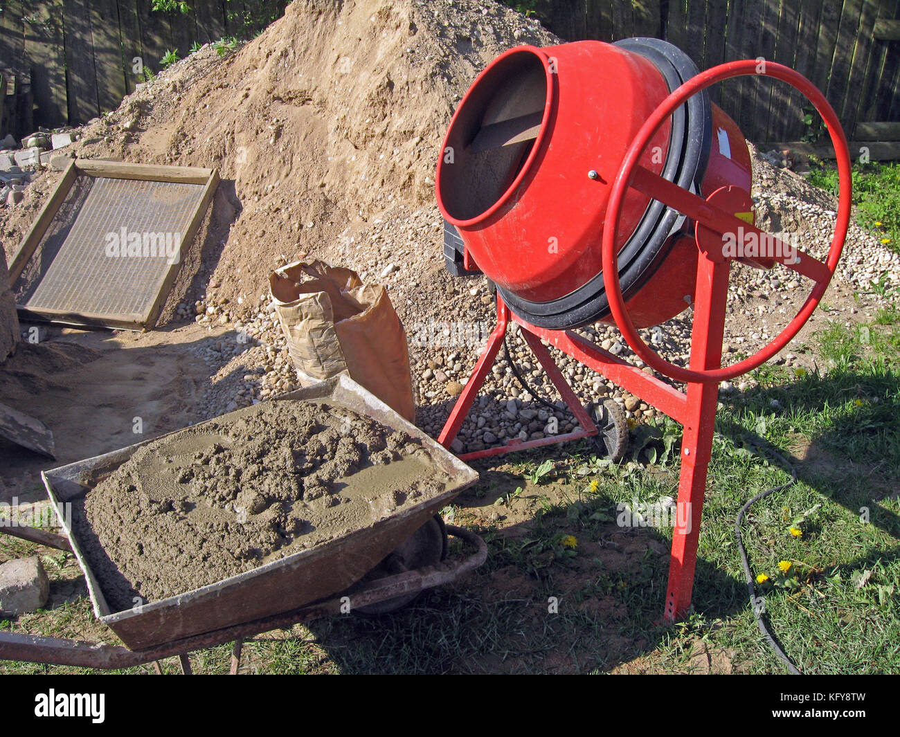Mortable electric cement mixer and wheelbarrow with cement mortar Stock Photo Alamy