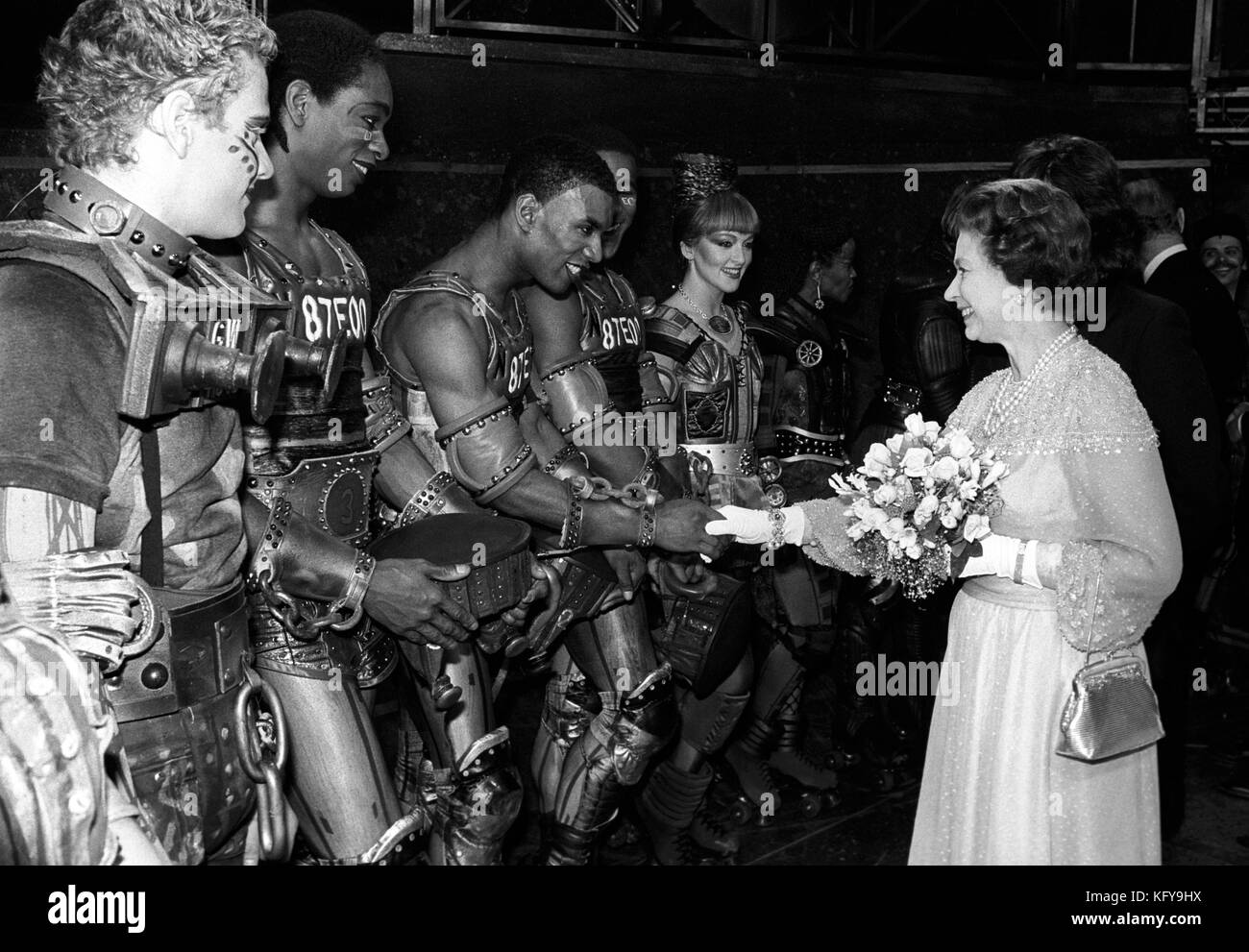 Queen Elizabeth II meets the cast of Andrew Lloyd-Webber's new roller-skating musical Starlight Express, at the Apollo Theatre, Victoria, London. Stock Photo